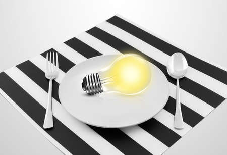 Lamp in plate and fork and spoon, Serving an idea conceptの写真素材