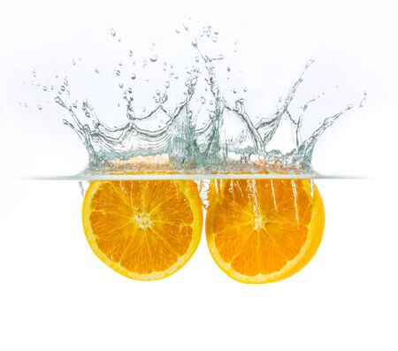 orange drop with water splashの写真素材