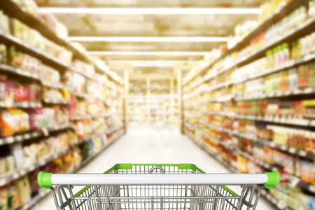 Abstract blurred photo of store with trolley in department store bokeh backgroundの写真素材