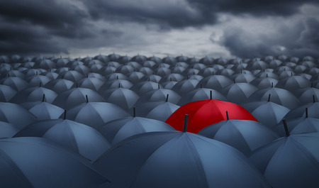Being different concept with red umbrella outstanding from the othersの写真素材