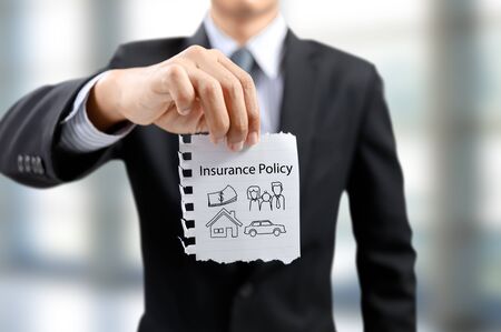businessman present insurance concept with money, car, family, people, houseの写真素材