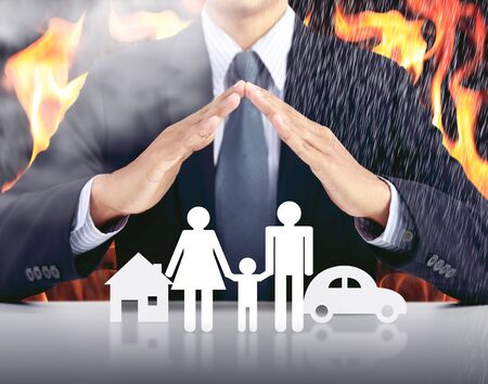 businessman, car, family, house with fire background, insurance conceptの写真素材