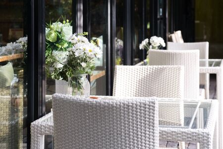 cozy warm white table and chair, outdoor, restaurantの写真素材