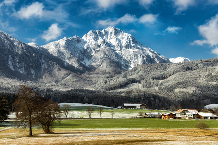 snowy mountain peak with village in autumn and spring, Europe travel destinationの写真素材