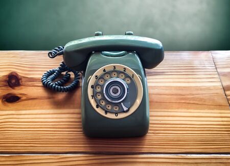Retro old vintage telephone on wooden table, communicationの写真素材