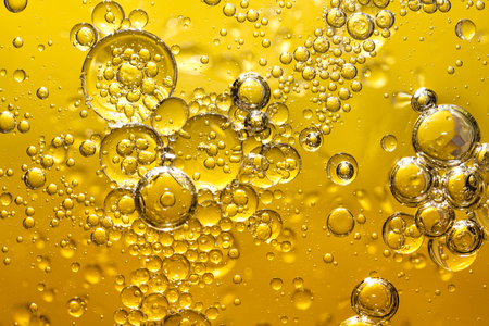 golden yellow bubble oil, abstract backgroundの写真素材