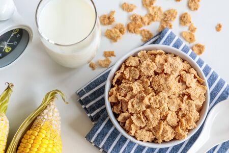 Healthy Corn Flakes with milk for Breakfast on tableの写真素材