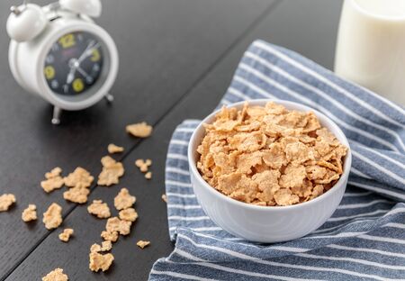Healthy Corn Flakes with milk for Breakfast on tableの写真素材