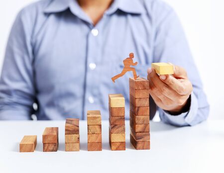 businessman climb up on stair to goalの写真素材