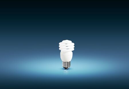 bright light bulb isolated on blue background, idea creativity
