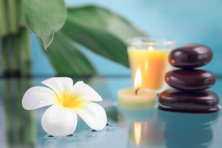 spa concept with candle, stone, flower and bamboo, relaxationの写真素材