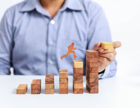 businessman climb up on stair to goalの写真素材