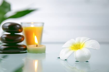 spa concept with candle, stone, flower and bamboo, relaxationの写真素材