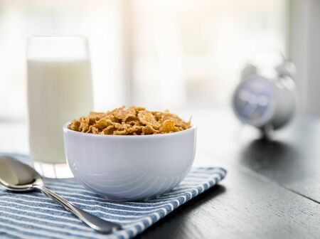 Healthy Corn Flakes with milk for Breakfast on table, food and drinkの写真素材