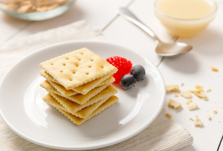 crackers with condensed milk and fruit, breakfastの写真素材