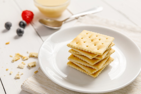 crackers with condensed milk and fruit, breakfastの写真素材