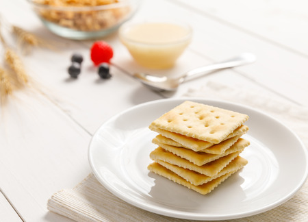 crackers with condensed milk and fruit, breakfastの写真素材