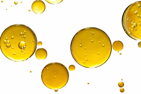 golden yellow bubble oil, abstract backgroundの写真素材