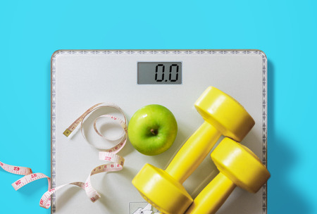 fruit, dumbbell and scale, fat burn and weight loss concept, dietの写真素材