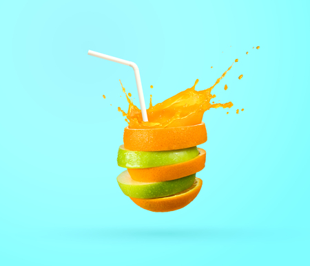 ripple cut fruit juice with strawの写真素材