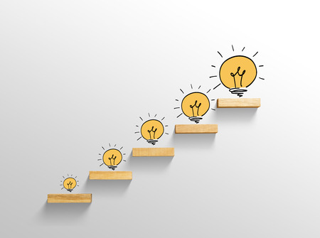 Light bulb on stairs, increase sizeの写真素材