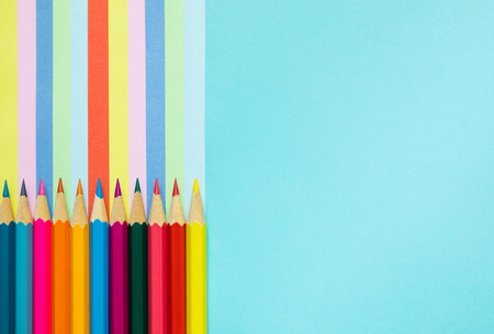Colored pencils and rainbow colorful stripes, stationaryの写真素材