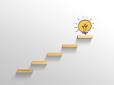 Light bulb on stairs, increase size, business successful conceptの写真素材