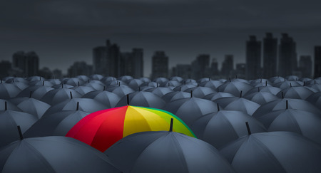Businessman with colorful rainbow umbrella among others, unique different conceptの写真素材