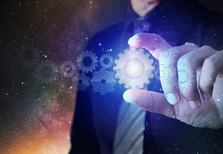 Businessman present set of gears, teamwork conceptの写真素材