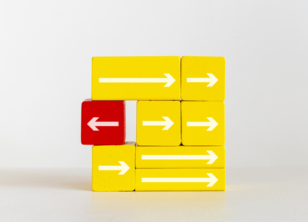 Unique different arrow on wooden blocks toys, different leadership conceptの写真素材