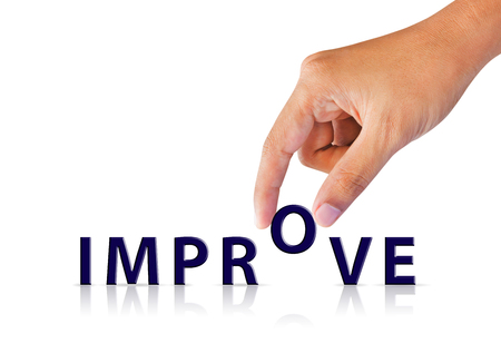 Businessman hand and word text improve, successful conceptの写真素材