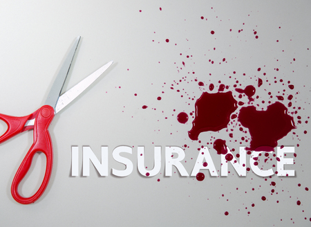 Scissor with injured blood and insurance wordingの写真素材