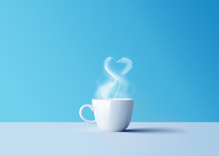 Hot black coffee in white coffee mug with aroma smoke and love heartの写真素材