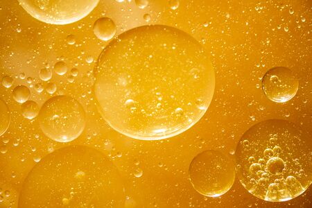 Golden yellow bubble oil droplet, abstractの写真素材