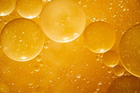 Golden yellow bubble oil droplet, abstractの写真素材