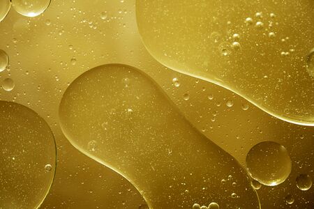 Golden yellow bubble oil droplet, abstractの写真素材
