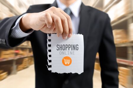 businessman present online shopping concept with shopping cart symbolの写真素材