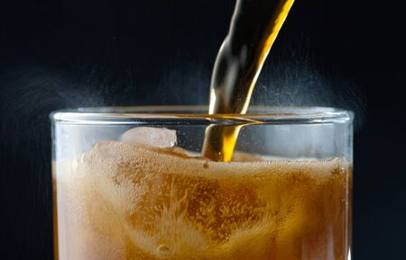 ice cube in fizzy splashing water with soda bubbleの写真素材