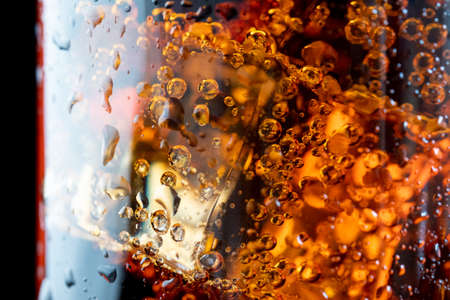 ice cube in fizzy splashing water with soda bubbleの写真素材