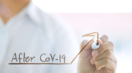 businessman drawing business graph about situation on glass wallの写真素材