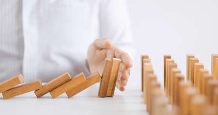 home protection with insurance concept with wooden home model and wooden blocksの写真素材
