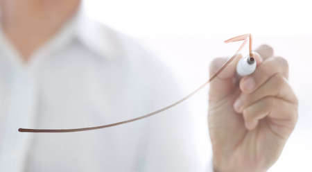 businessman drawing rising business graph, business growthの写真素材