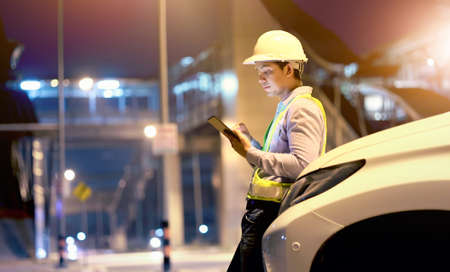 engineer working on digital tablet at construction siteの写真素材