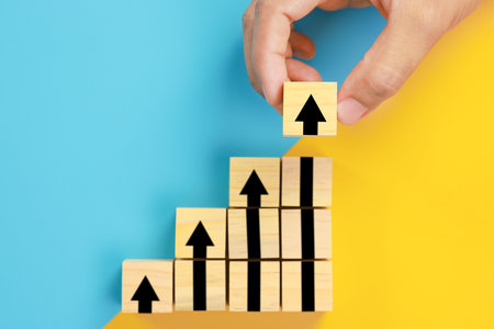 wooden block cubes with rising business graph