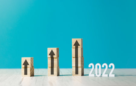 wooden cubes with rising business growth graph chartの写真素材