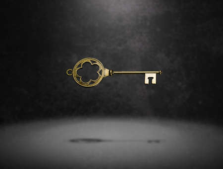isolated vintage old golden and bronze key, successful conceptの写真素材
