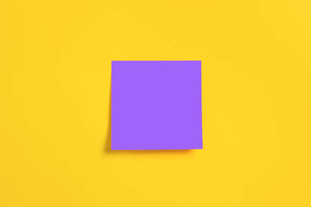 blank adhesive sticky note memory notepad on a boardの写真素材