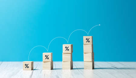 wooden cubes with rising business growth graph chartの写真素材
