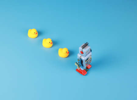 vintage retro robot and Yellow Rubber Bath Ducks, leadership conceptの写真素材