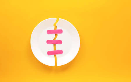 White plate on yellow background. Minimal food concept.